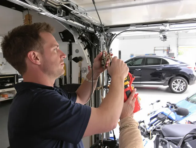 Acushnet Garage Door Repair safety certified technician performing cable replacement in Acushnet