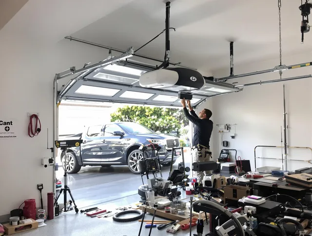 Acushnet Garage Door Repair specialist installing smart garage door opener system in Acushnet home