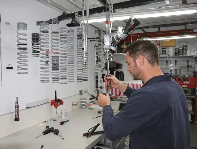 Acushnet Garage Door Repair safety certified technician performing precision spring replacement in Acushnet